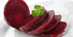 sliced organic beet root on a white plate